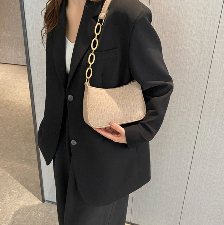 Magnella | Elegant skulderveske i krokopreget design